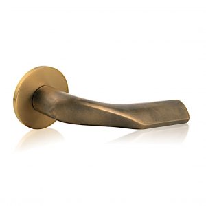 Sogut lever handle by M&T in antique brass finish